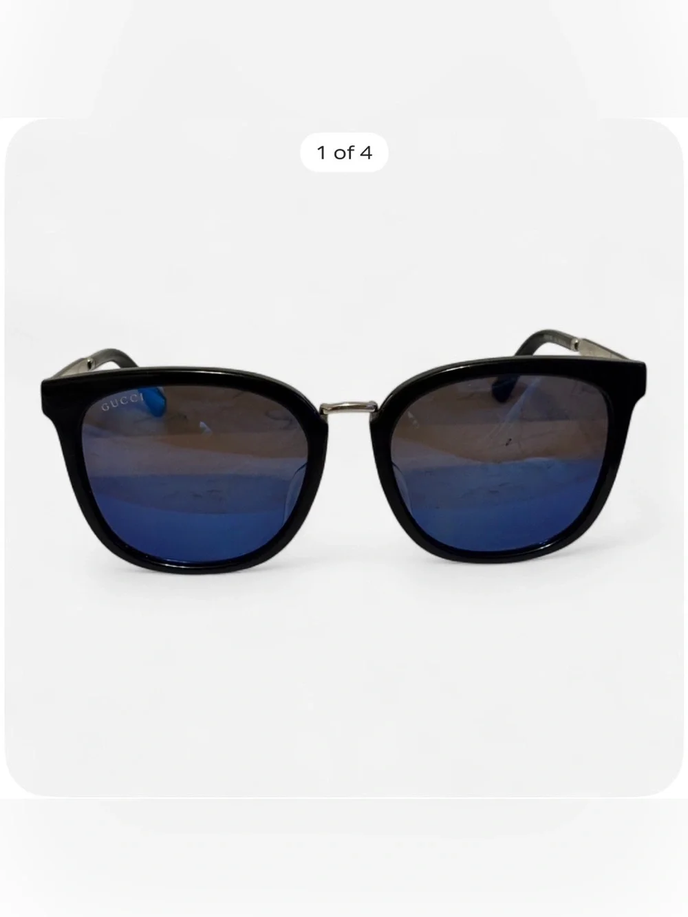 Gucci Black Frame Sunglasses with Blue Lenses